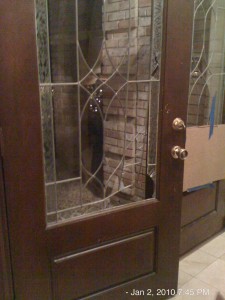 Broken Front Door Ferocious dog keeps all friends and strangers at bay.