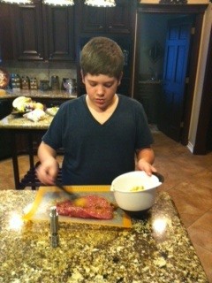 Glazing the pork tenderloin.