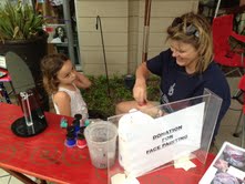 Jennifer Moore with Jennika's doing face painting.